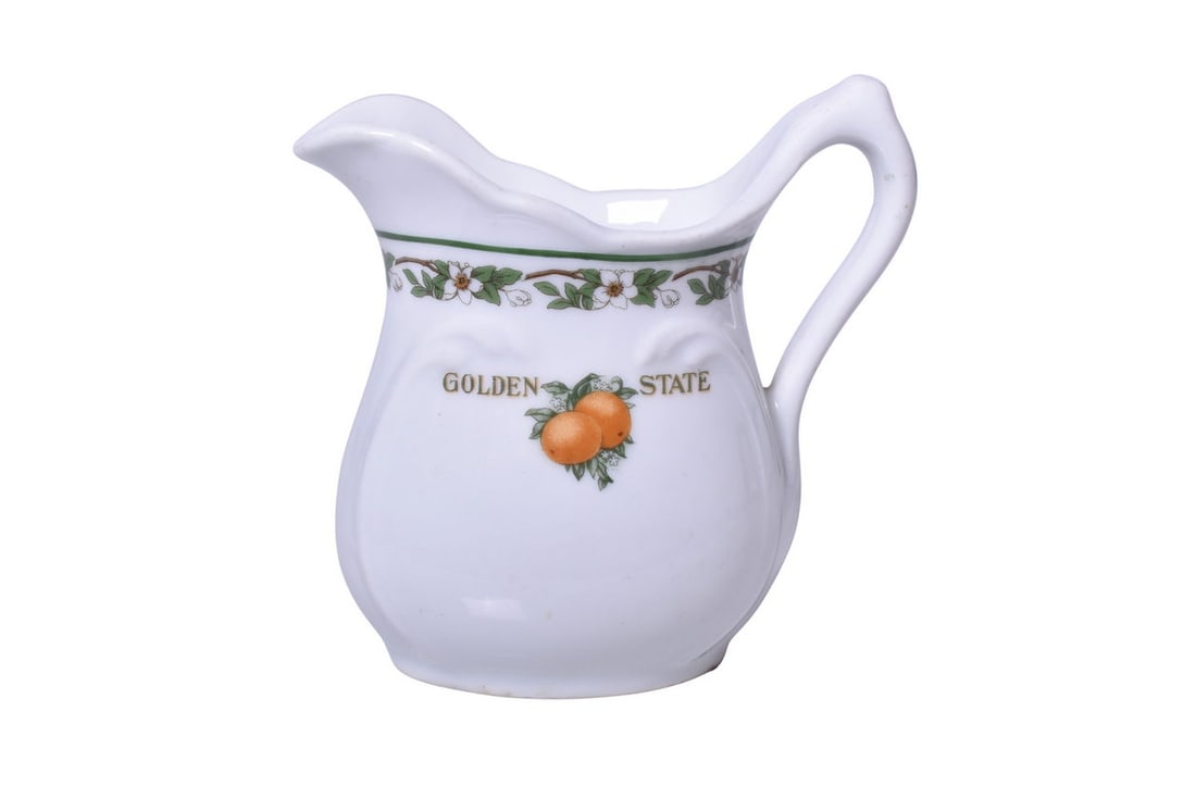 Chicago, Rock Island & Pacific Railroad China Golden State Creamer Pitcher: A 4" tall cream pitcher for the Rock Island Railroad in the Golden State pattern by Bauscher 1924, with logo side mark. The creamer shows minimal to mild use with some light scratches on the body and