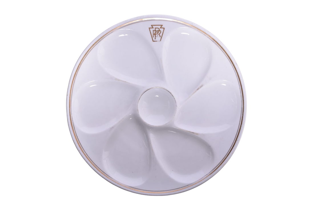 Cauldon Pennsylvania Railroad Gold Keystone China Oyster Plate: An 8 7/8" dining car china oyster plate with 6 wells and center sauce for Pennsylvania Railroad in the Gold Keystone pattern, top marked with PRR keystone in gold and bottom stamped Cauldon England Ma