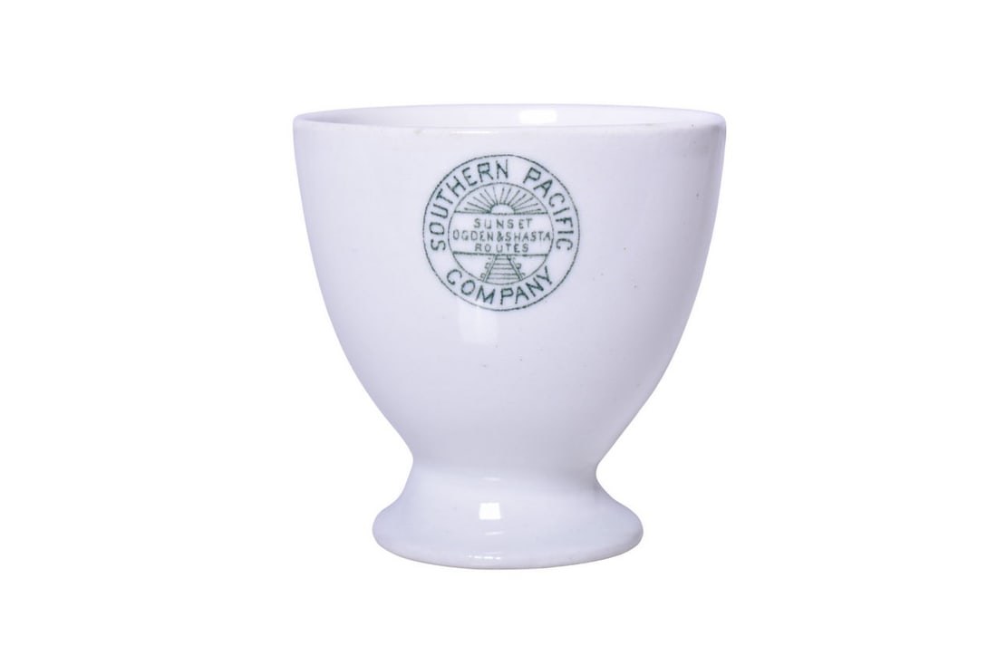Southern Pacific Railroad China Stanford Green Pedestal Double Egg Cup: A 3" tall pedestal double egg cup for the Southern Pacific Company Railroad in the Stanford pattern, side marked with the Sunset Ogden & Shasta Routes logo, no makers mark. Pieces in this pattern date