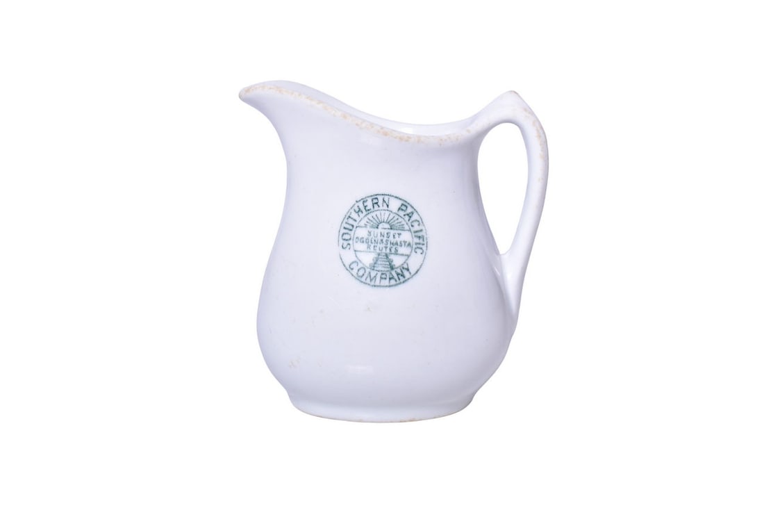 Southern Pacific Railroad China Stanford Green Cream Pitcher: A 4" tall creamer for the Southern Pacific Company Railroad in the Stanford pattern, side marked with the Sunset Ogden & Shasta Routes logo, by John Maddock & Sons. Shows general signs of use with scr