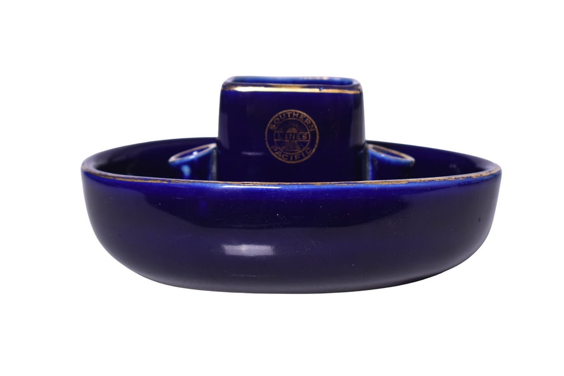 Southern Pacific Railroad Hall China Cobalt Blue Ashtray: A 6" x 3" tall cobalt blue china ash tray with gold detail side marked on both sides for the Southern Pacific Lines Railroad by Hall. This is the same piece that was photographed and featured on page