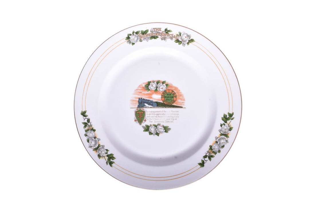 Missouri Pacific Railroad China Sunshine Special Service Plate: A 10 1/4" service dinner plate for Missouri Pacific Railroad top marked with "The Sunshine Special" along the edge and a vignette with note in the center and logo for Iron Mountain Route I&GN, T&P, ST
