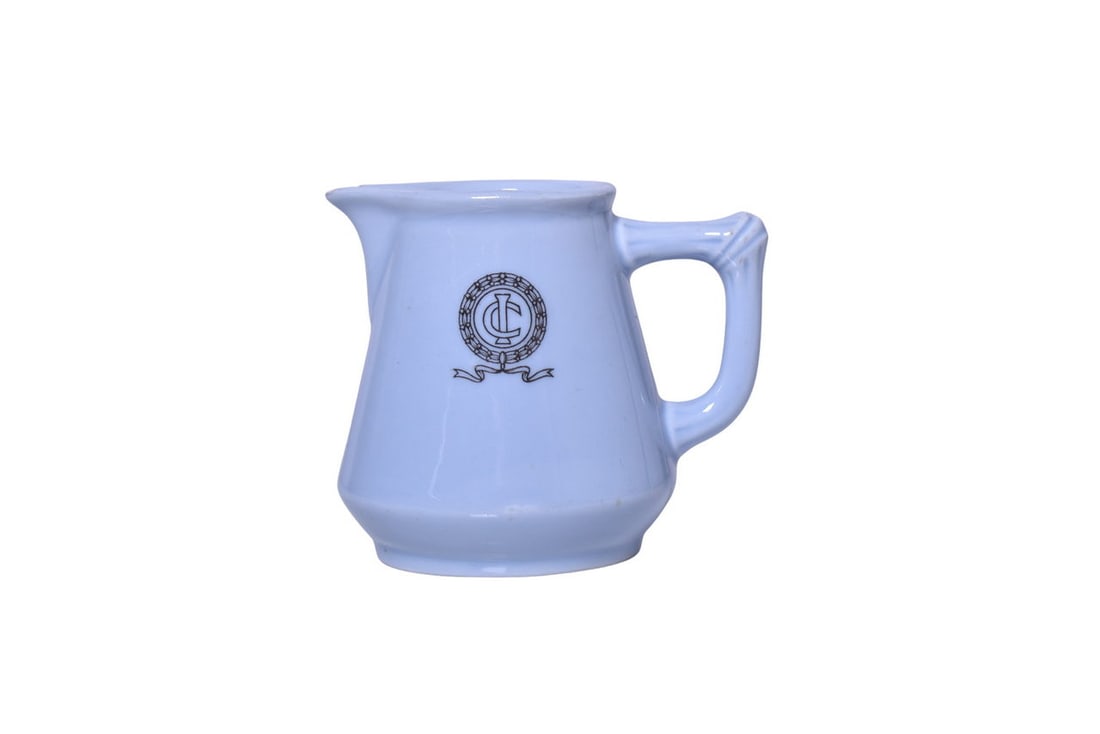 Illinois Central Railroad China Creole Blue Creamer: A 3 1/4" tall cream pitcher for the Illinois Central Railroad in the Creole Blue pattern, side marked on both sides with the IC logo, by Bauscher. This is the same creamer that was photographed and fe