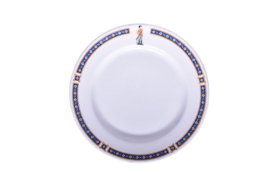 Boston and Maine Railroad China Minuteman Bread Plate: An 8 1/8" china plate for the Boston and Maine Railroad in the Minuteman pattern, top marked with Minuteman figurine, by Syracuse 9-G Kenmoor Copyrighted 1923. The plate has nice clean graphics and sh