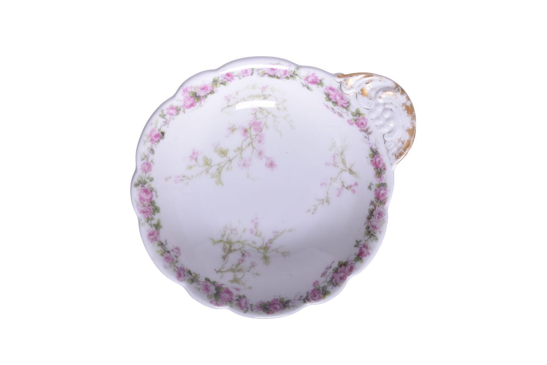 Michigan Central Railroad China Ice Cream Shell Bowl: A 5" diameter dining car china tabbed ice cream shell or bowl with floral pattern, bottom stamped Haviland & Co. Limoges For Michigan Central Railroad. The dish shows a few light scratches in the bowl