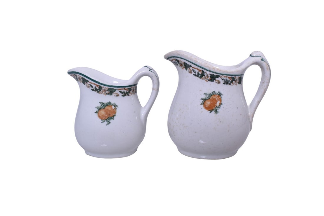 Pair of Southern Pacific Railroad China Imperial Creamers: A pair of dining car china cream pitchers or creamers for the Southern Pacific Railroad in the Imperial pattern, bottom stamped with the Sunset Ogden & Shasta Routes logo by Maddock. A 2 5/8" tall cre
