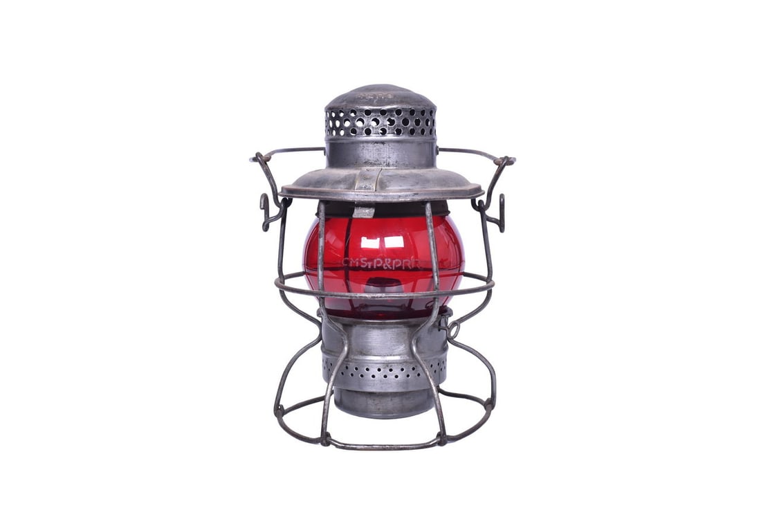 Adlake Kero Milwaukee Road Lantern w/ Etched Red Globe: Adams & Westlake Adlake Kero with CMST.P & P embossed on the shoulder. Patent date found on the bottom of the lantern reads 1-51. Lantern body is in good shape with a few spots of rust and some small