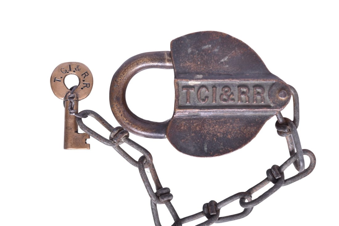 Tennessee Coal Iron & Railroad Brass Heart Shaped Lock w/ Key: Brass heart shaped lock with TCI&RR cast in the rectangular front panel. Included is an Adlake key with T.C.I. & R.R. with 237C in serif font marked on the reverse. The key does operate the lock as in