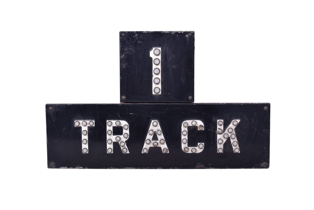 Porcelain Railroad Crossing "1 Tracks" Sign with Plastic Reflectors: Sign measures 27 1/4" wide by 16 3/4" tall. Porcelain is in good condition with some chipping and rust near the lower edge. Two of the reflectors are missing. Backing plate and original mounting brack