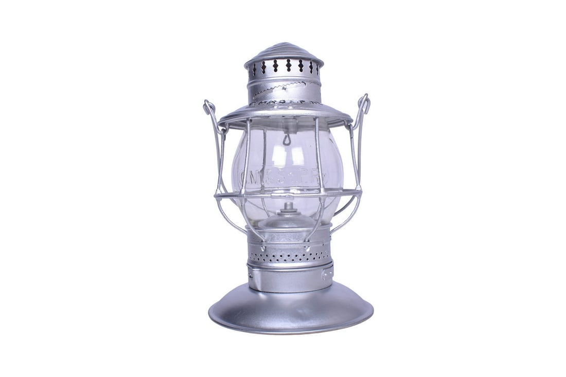 Electrified Bell Bottom Chicago Milwaukee and St. Paul Railway Railroad Lantern: Bell bottom lantern with CM&St.P RY embossed on the top. Lantern has been recently painted silver with black on the embossed letters. Latest patent date reads May 28, 1895. Frame is in good shape, no 