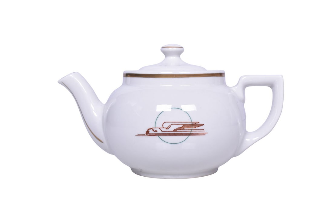 Union Pacific Railroad Winged Streamliner China Teapot: A Boston style teapot side marked with the Streamliner logo and bottom marked Sterling China East Liverpool Ohio. Teapot Measures 7 1/2" x 5" x 4 1/2" tall and presents in excellent condition with cle