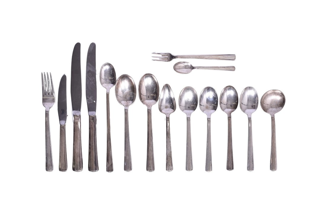 Fifteen Pieces of New York Central Railroad Dining Car Silverware - Century Soda Spoons, Oyster: This collection of silverware is all bottom stamped "International Silver" and each piece bears the "NYC" logo of the New York Central Lines. The group shows moderate wear with nicks and scuffs presen