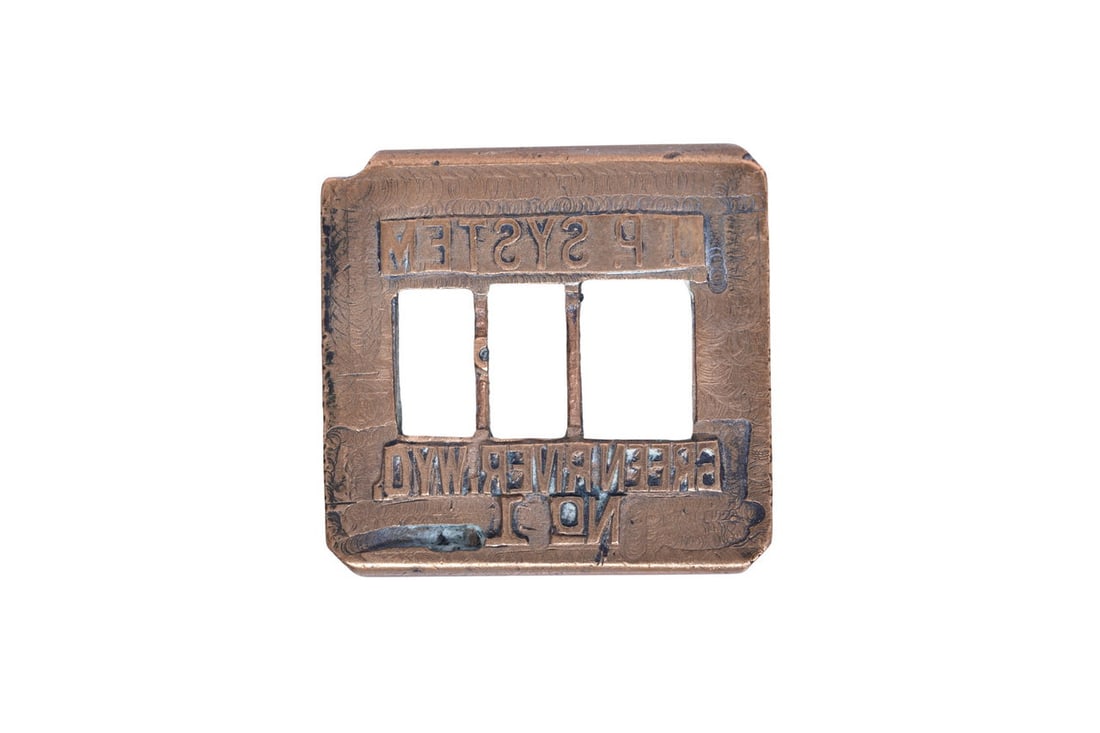 Union Pacific Green River Wyoming Ticket Dater Die: Union Pacific ticket dater die which stamps U.P. System Green River, WYO. No 1. This die shows a bit of wear, most notable on the lettering which shows some wear at the edges of the die.
