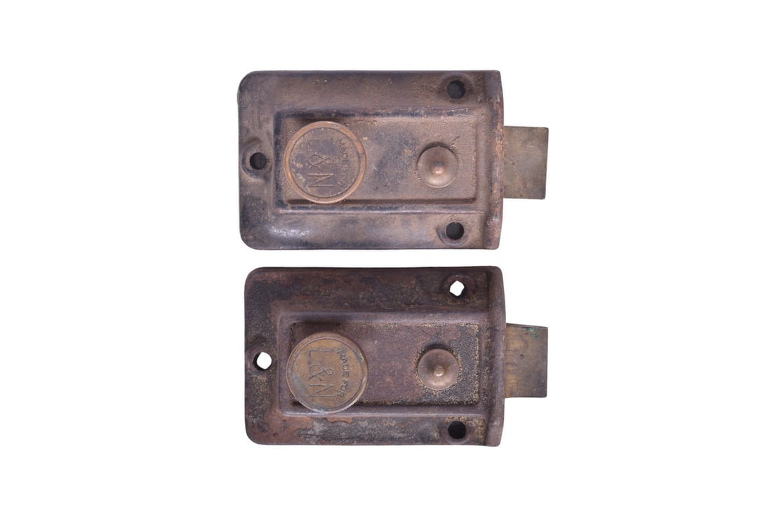 Pair of Louisville and Nashville Railroad Door Lock Sets: A smaller pair of door lock sets, each with a knob stamped "Made for L&N". Each set measures about 2 1/2" by 3 1/2", and seems to be oriented with the lock facing up, possibly for use as a cabinet /