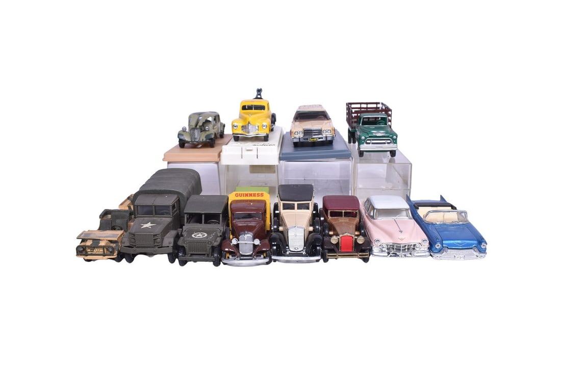 Twelve model cars, all roughly 1:43 scale. Model makers include ERTL, Solido, and Eligor. Includes (1 of 3)