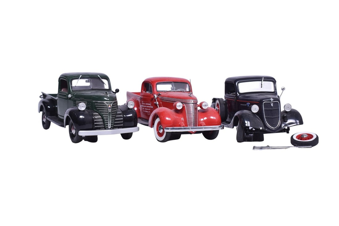 Three Danbury Mint 1:24 scale diecast pickup models: 1935 Ford, 1941 Plymouth, and 1937 Studebaker. (1 of 3)