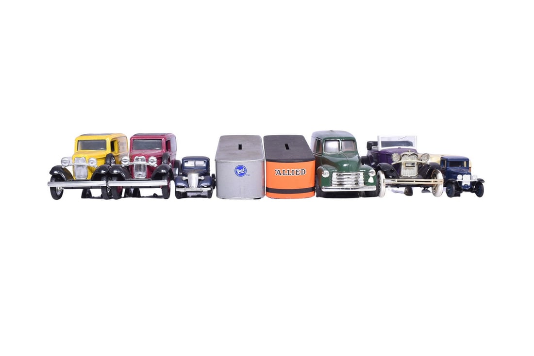 Six ERTL and one Liberty Classics model car coin banks of varying scales, with standouts including a: Six ERTL and one Liberty Classics model car coin banks of varying scales, with standouts including a purple Ford Model 'A' and a green Hemmings Motor News panel van. Two 1:25 scale 1932 Panel Delivery