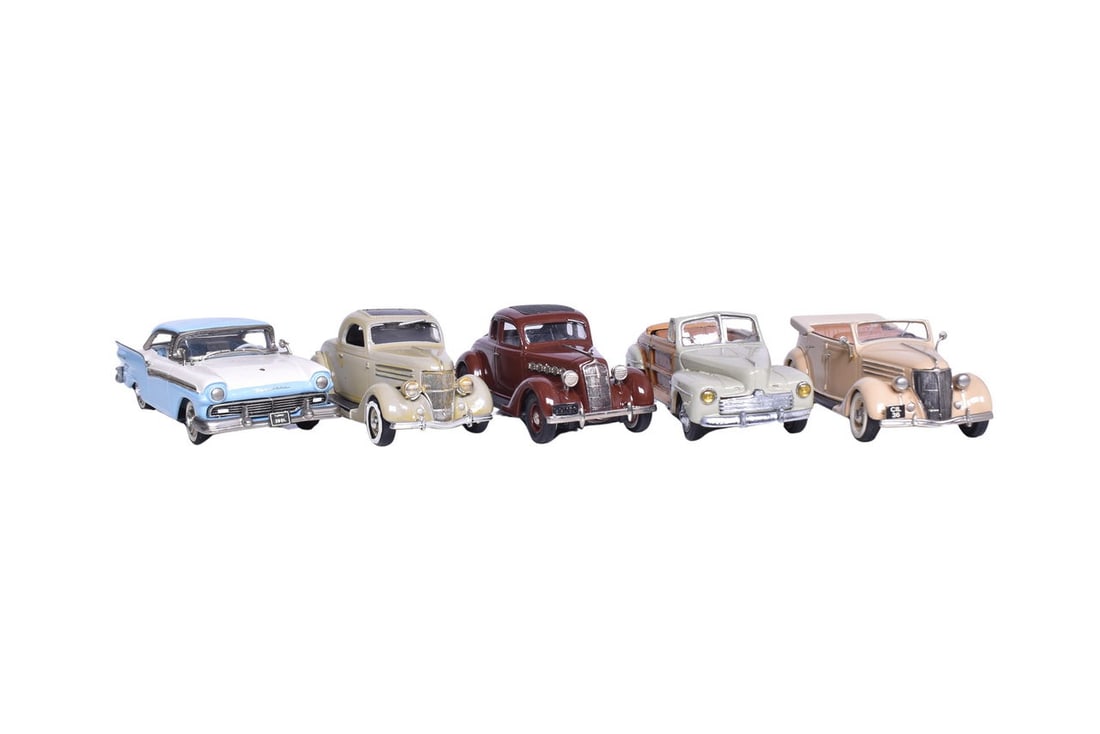 Five 1:43 scale model cars, one by Brooklin Models, two by Mini Marque, an Auto Buff model, and a: Five 1:43 scale model cars, one by Brooklin Models, two by Mini Marque, an Auto Buff model, and a CCC US model. Includes a 1935 Plymouth Deluxe, a 1957 Ford Fairlane, a 1930s Ford V8 convertible, a 19