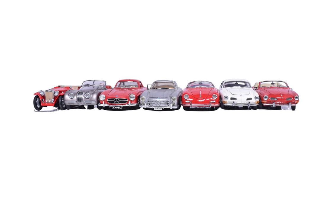 Seven model cars, two by Paul's Model Art, one by Revell, one by Burago, one by Danbury Mint, and (1 of 6)