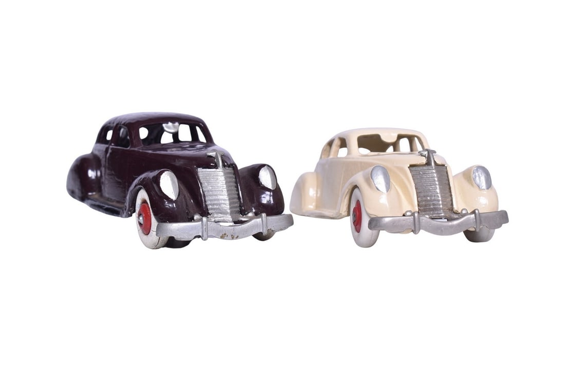 Two larger diecast metal cars, one cast with Thomas 77 81 on the inside top of the roof, and the (1 of 4)