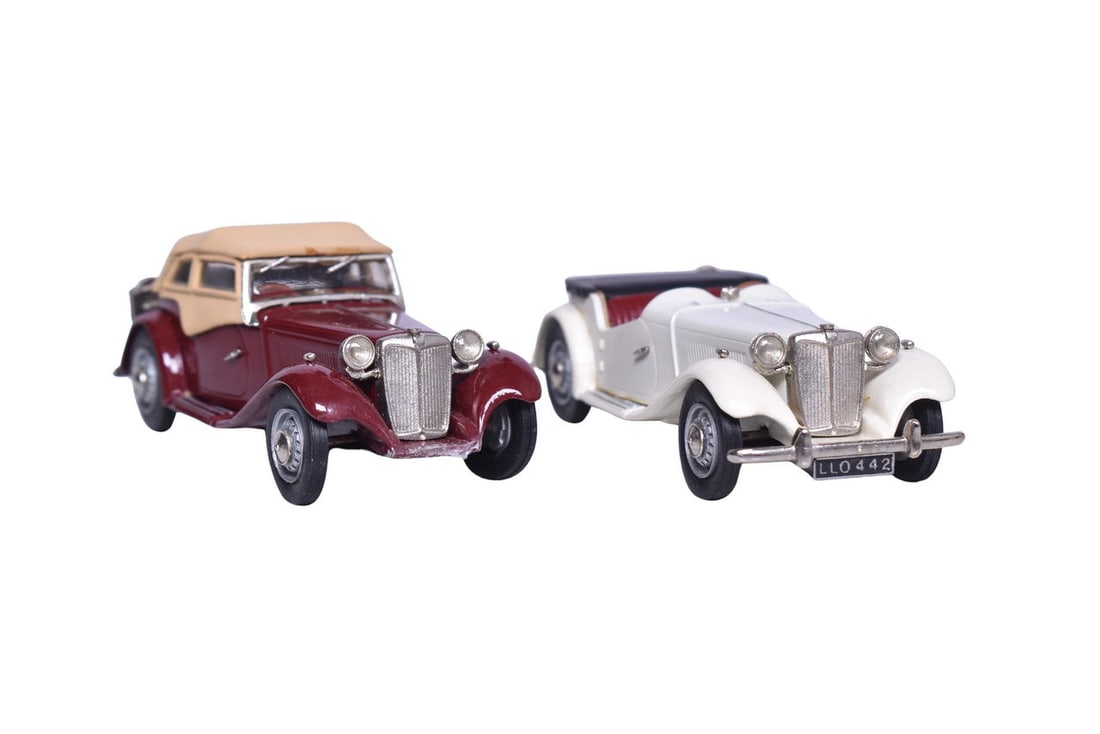 Two K & R Replicas white metal 1:43 scale models, one marked 112 on the bottom, the other marked (1 of 3)