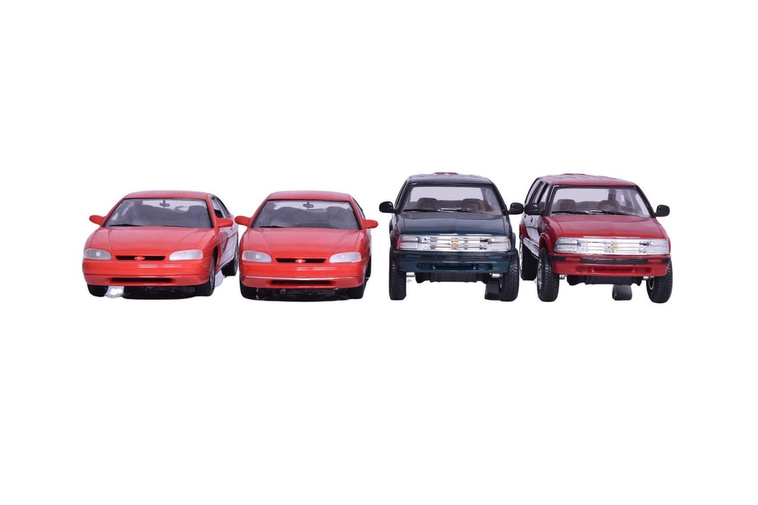 Four Chevrolet dealership promotional models: a 1995 Blazer, a '96 Blazer and two 1995 Monte Carlos. (1 of 5)