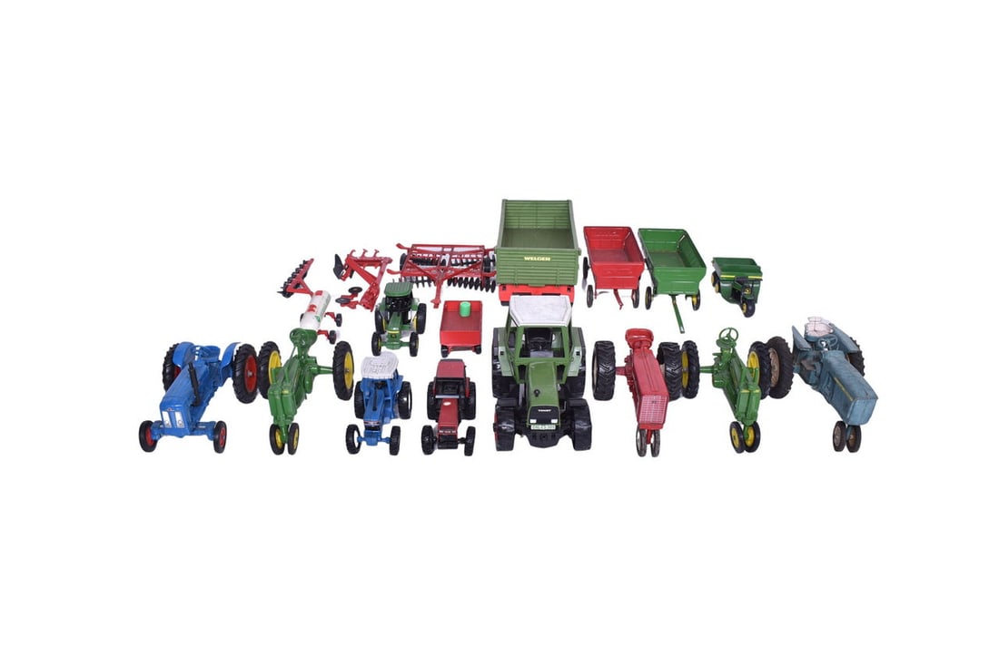 Group of sixteen peices of farming tractors and implement toys. These include John Deere, Fordson,: Group of sixteen peices of farming tractors and implement toys. These include John Deere, Fordson, Ford, Case, and more. Toys range from like new to some paint fading or minor chips. No major issues.