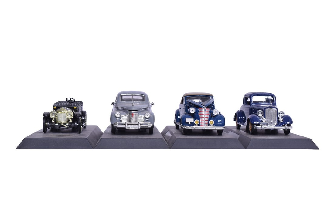 Group of four New Ray 1:32 Chevrolet die cast models with bases including 1911 classic 6 roadster, (1 of 5)