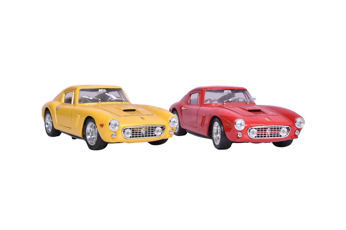 Pair of Jeouf Evolution 1:18 die cast Ferrari 250 GT Berlinetta 61 cars in red and yellow. No boxes.: Pair of Jeouf Evolution 1:18 die cast Ferrari 250 GT Berlinetta 61 cars in red and yellow. No boxes. Both are in good condition, though a bit duty from display.
