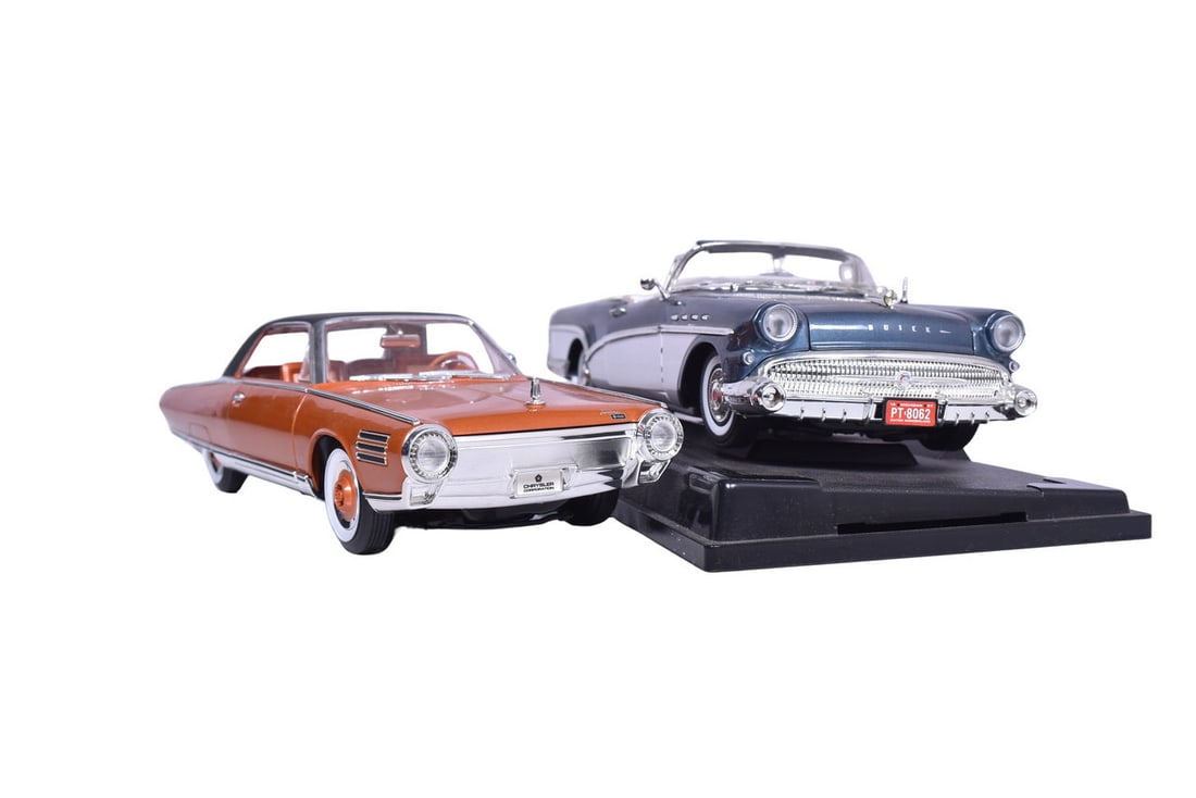 Two 1:18 scale model cars: a Motor Max 1957 Buick Roadmaster in metallic blue and a Road Signature: Two 1:18 scale model cars: a Motor Max 1957 Buick Roadmaster in metallic blue and a Road Signature 1963 Chrysler Turbine in metallic orange. The Buick comes with its original plastic display platform.