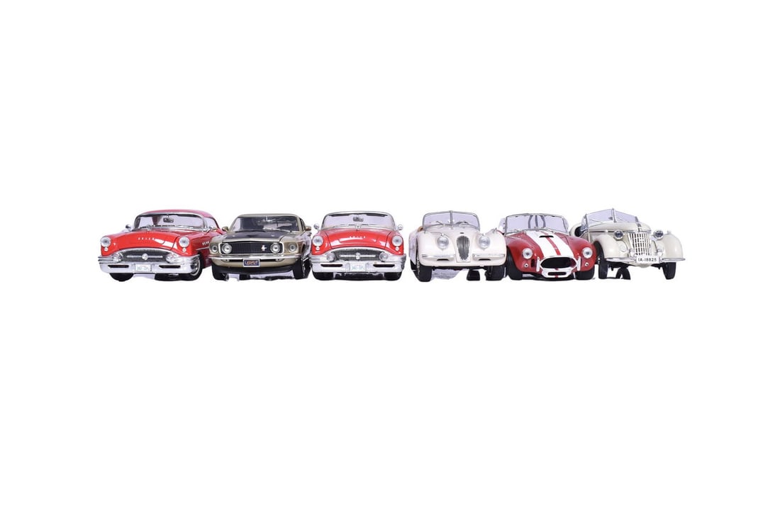 Six 1:18 scale models, three by ERTL, one by Ricko, and two by Mira. ERTL models are a 1948 Jaguar (1 of 5)