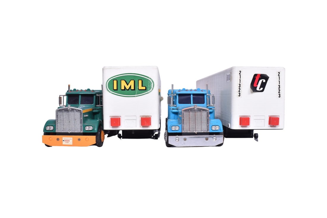 Two Kenworth truck tractors and trailers, each decorated for a different company, one IML and one (1 of 3)