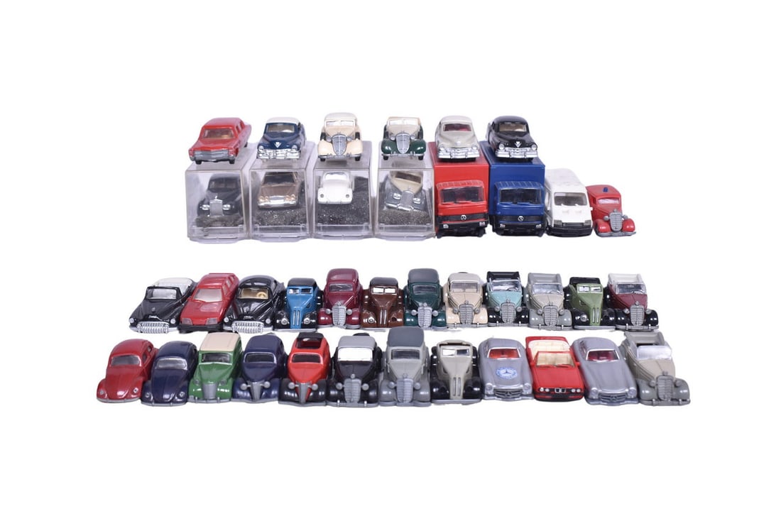 Thirty-eight Praline model cars, the largest roughly 3 1/4" long. Makes of car spotting in the: Thirty-eight Praline model cars, the largest roughly 3 1/4" long. Makes of car spotting in the group include Buick, Volkswagen, Opel, Mercedes, Ford, Cadillac, and BMW. Four cars have their original p