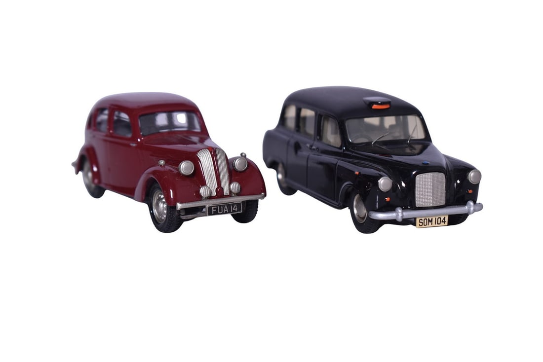 Two Somerville white metal 1:43 scale model cars. Includes No. 104 Austin FX4 Taxi in black and No. (1 of 3)