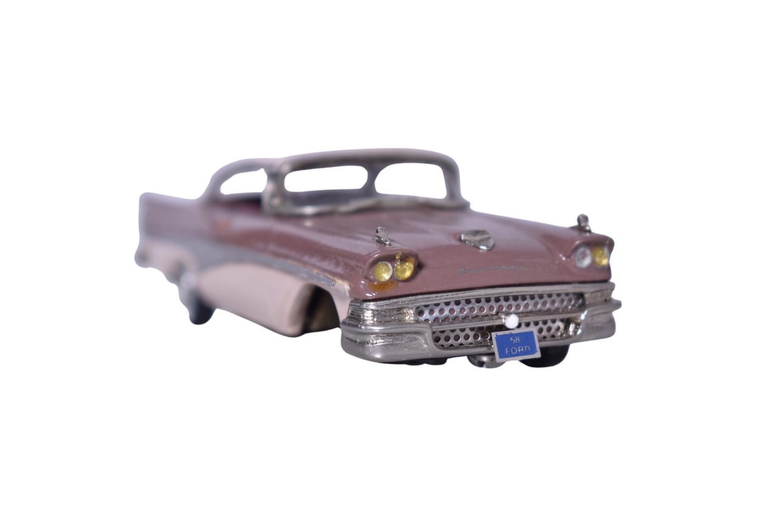 Marque One Models resin 1:43 scale 1958 Ford Fairlane in lilac and pink. Car comes with its: Marque One Models resin 1:43 scale 1958 Ford Fairlane in lilac and pink. Car comes with its original clear plastic display platform, detached passenger side wheel, missing passenger side door handle, 