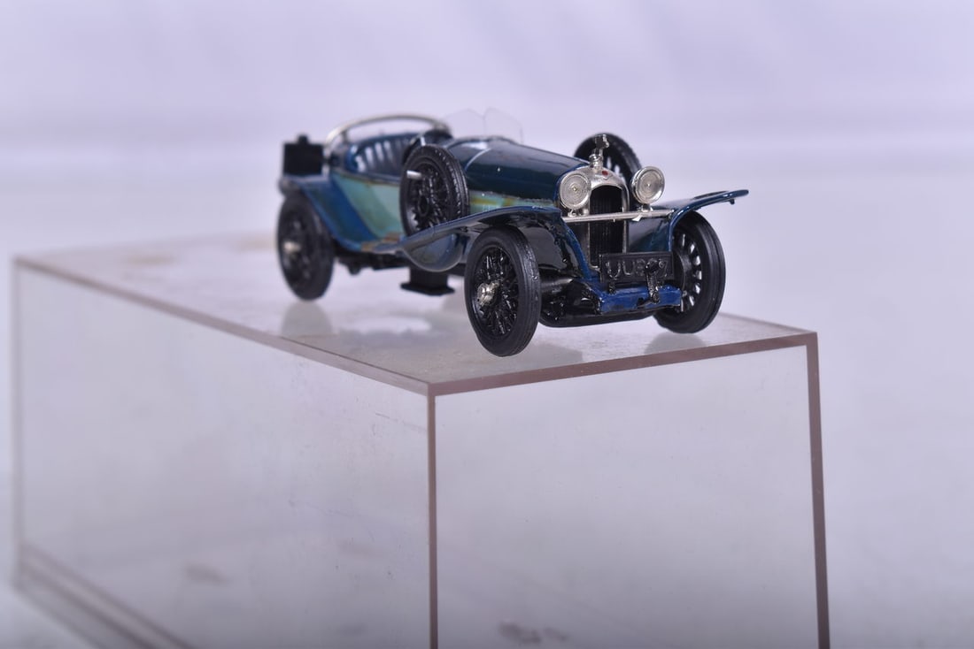 White metal model believed to be approximately 1:64th scale depicting a late 1920's Bugatti, likely: White metal model believed to be approximately 1:64th scale depicting a late 1920's Bugatti, likely a Model 23. Good paint and details, car has no makers marks other than MA being scratched into the u