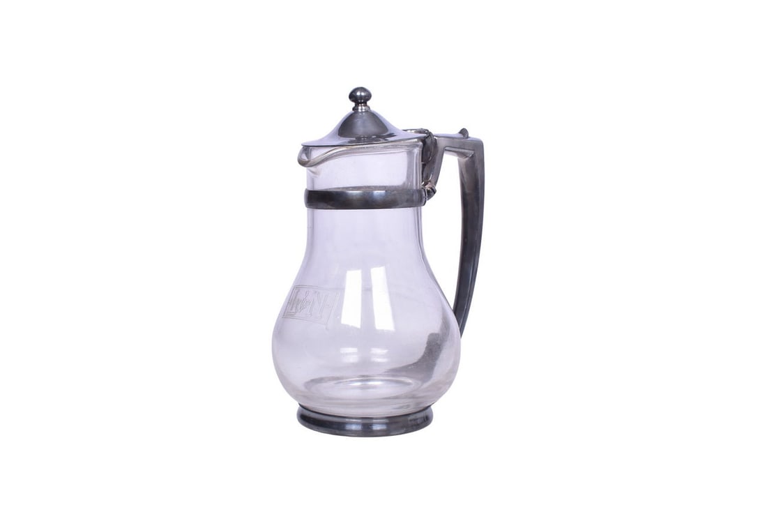 Louisville and Nashville Railroad Silver Glass Water Carafe A large glass water carafe or coffee pot: Louisville and Nashville Railroad Silver Glass Water Carafe A large glass water carafe or coffee pot for Louisville and Nashville Railroad etched with the L&N box logo on the front of the glass. M