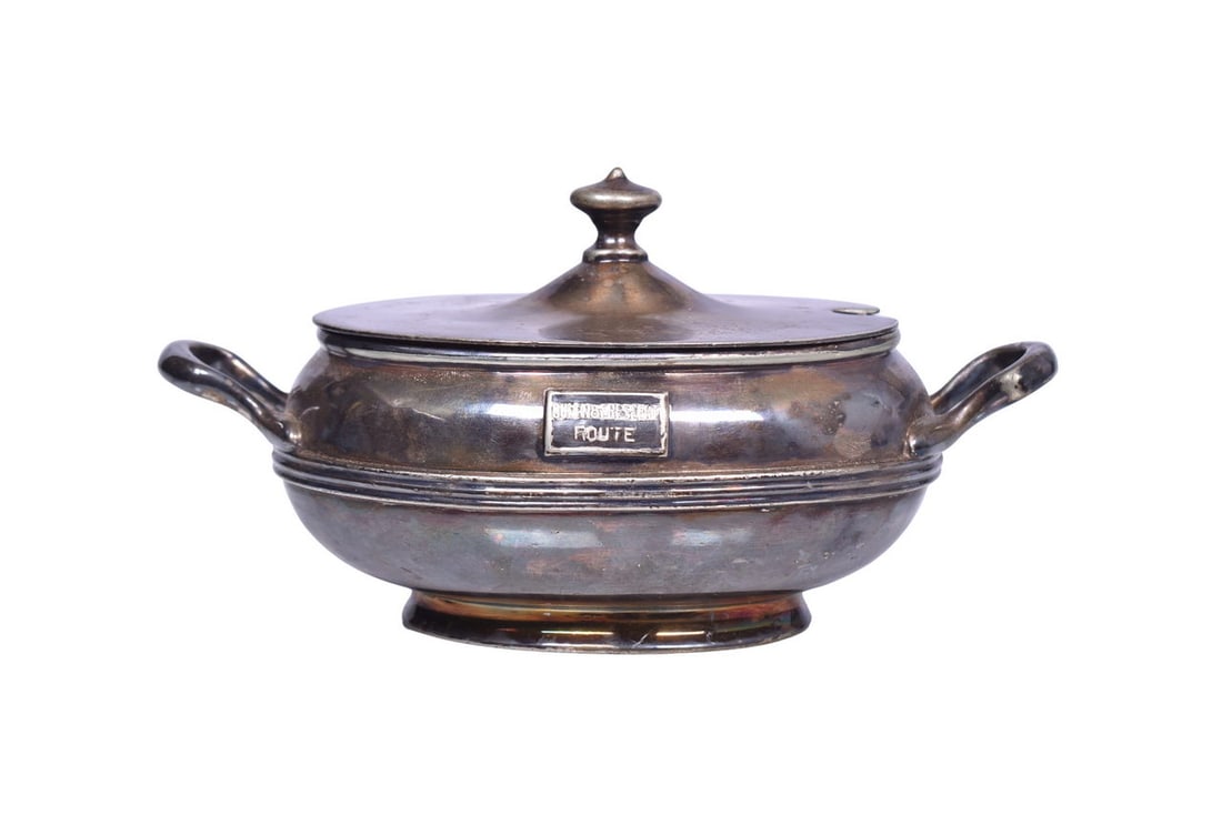 A 16 ounce sugar bowl with lid, bottom stamped 708 Smith Silver Co. Silver Soldered, side marked: A 16 ounce sugar bowl with lid, bottom stamped 708 Smith Silver Co. Silver Soldered, side marked with applied Queen & Crescent Route box logo. Measures 7 3/4" wide at the handles by 4 1/4" tall. O