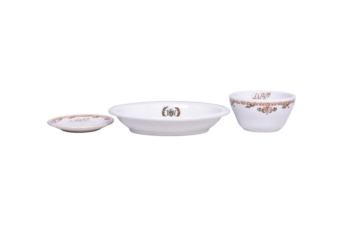 Three pieces of dining car china for the Norfolk and Western Railroad. Includes a 3 7/8" diameter: Three pieces of dining car china for the Norfolk and Western Railroad. Includes a 3 7/8" diameter bullion cup in a white base and a 4" butter pat with an ivory base, both in the Cavalier pattern with 
