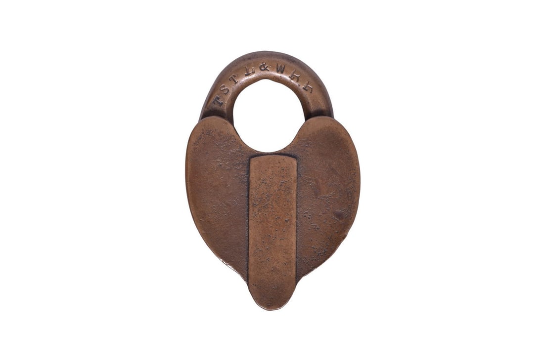 Heart shaped brass lock with TSTL&W RR stamped on one side of the shackle and E. T. Fraim Pat (1 of 3)