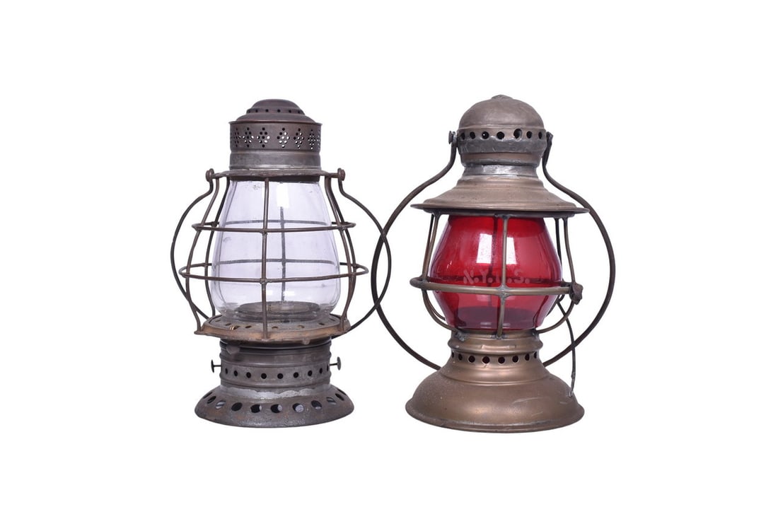 An unmarked presentation lantern with a red etched NYCS globe, and an older design tin lantern. The (1 of 5)