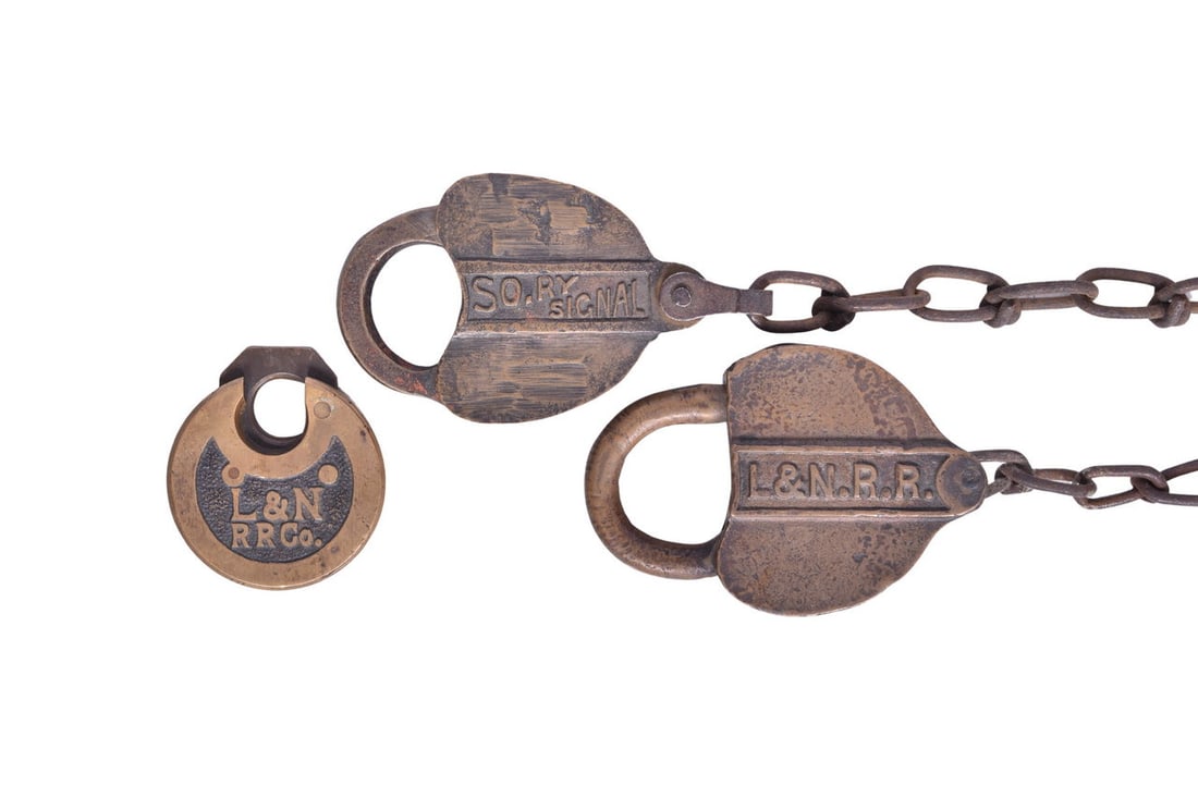 Three brass railroad locks from down South: a L&N pancake lock, a heart-shaped L&N RR lock (1 of 3)