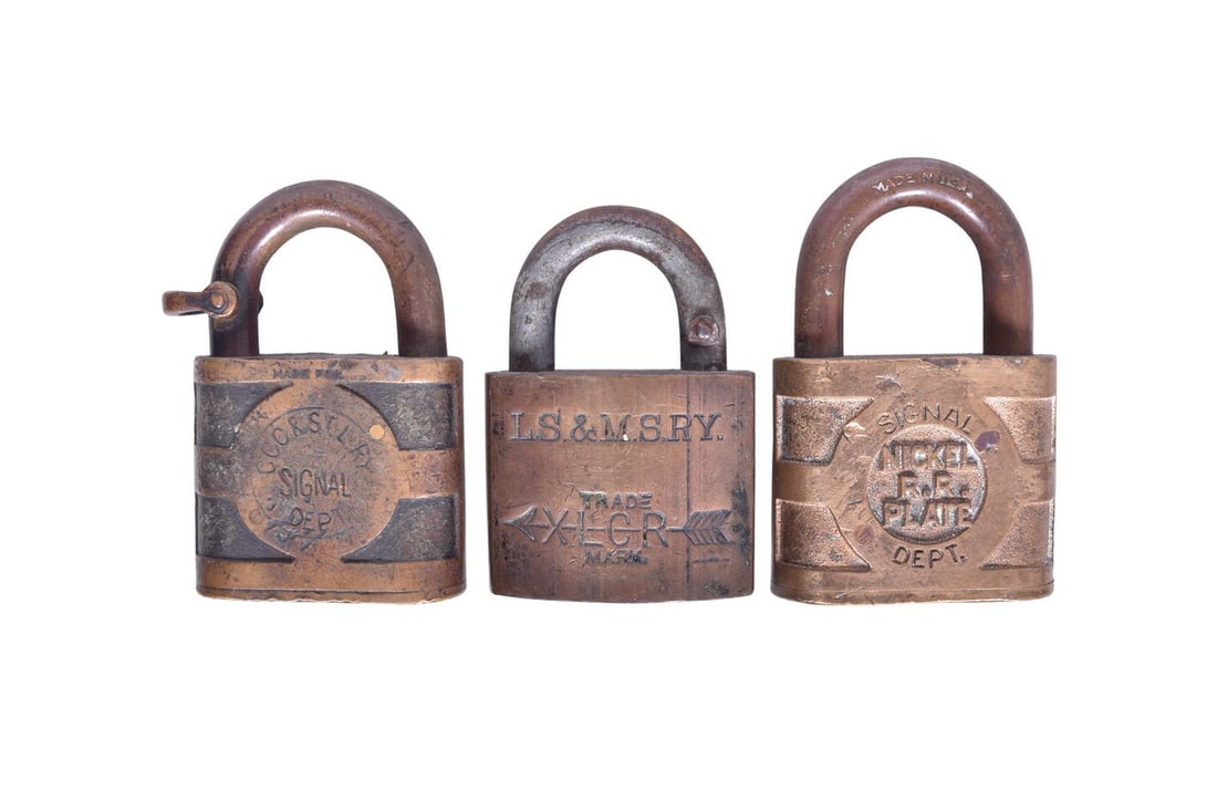 Three brass tumbler style locks: one for Cleveland, Cincinnati, Chicago and St. Louis Railway / Big (1 of 3)