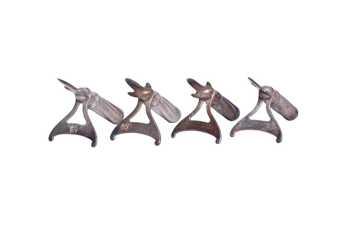 Group of four silver corn holders, all measuring 3 1/8". Two are stamped PRRR in cursive on the (1 of 4)