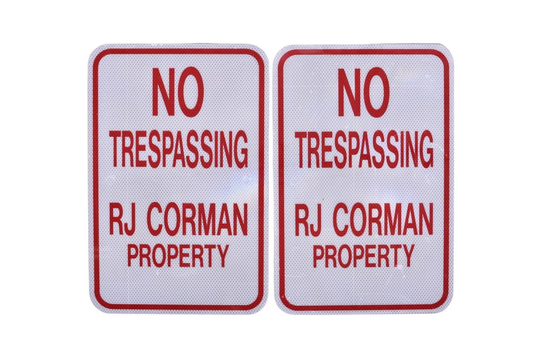 Two new-old stock aluminum signs measuring 18" x 12" each. The front of each says "No Trespassing RJ
