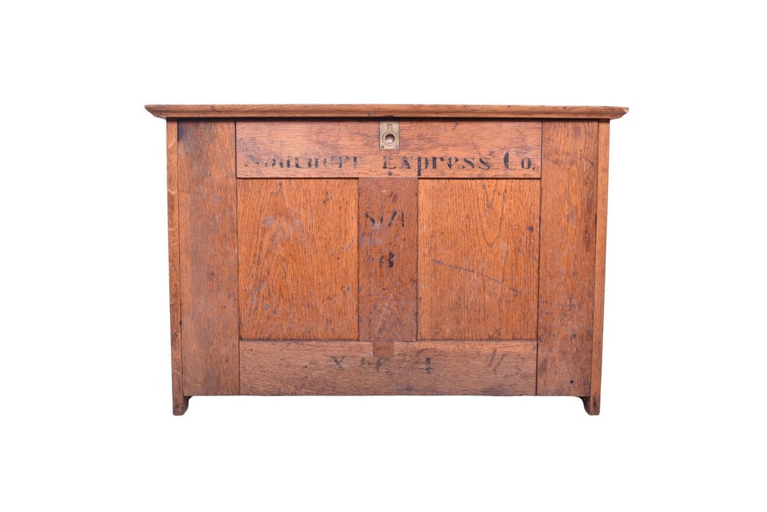 31" by 16 3/4" by 20 1/2" tall wooden cabinet with Southern Express Co. painted on the door. There: 31" by 16 3/4" by 20 1/2" tall wooden cabinet with Southern Express Co. painted on the door. There is a small tag on the left side stamped 402372. Cabinet opens to several wooden shelves and dividers,
