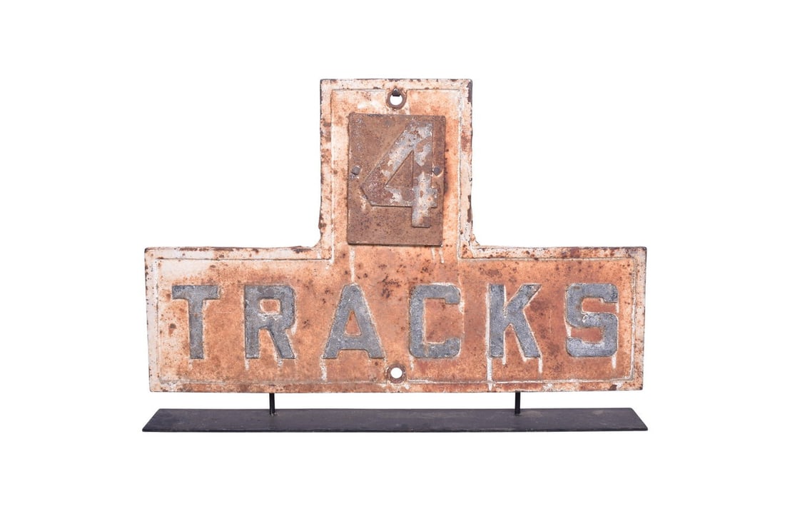 A 27 1/4" x 17" cast iron "4 TRACKS" railroad sign. Shows moderate rust and wear from age. Comes (1 of 3)