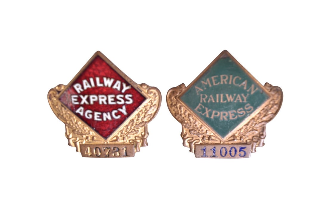 A pair of 2" brass enameled railroad badges. Includes American Railway Express 11005 with green: A pair of 2" brass enameled railroad badges. Includes American Railway Express 11005 with green enamel background and blue enamel numbers. The green background is slightly chipped at the top and right