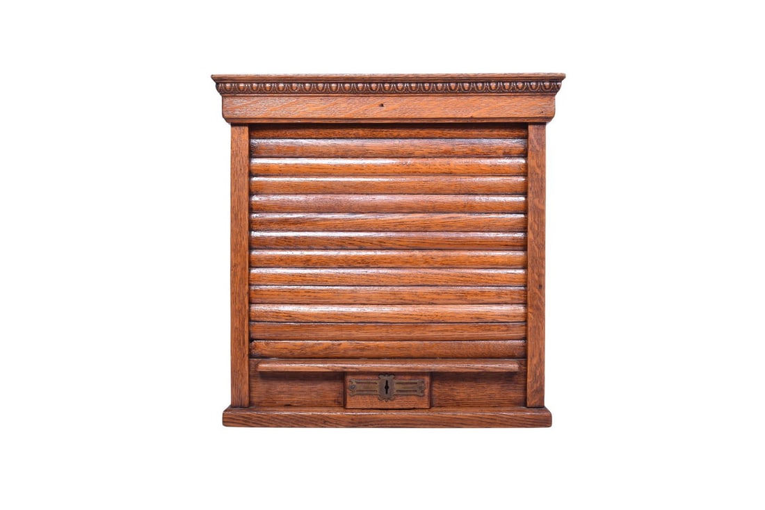 16 1/4" wide by 8 1/2" deep by 16 3/8" tall wooden ticket cabinet. The back of the cabinet has a: 16 1/4" wide by 8 1/2" deep by 16 3/8" tall wooden ticket cabinet. The back of the cabinet has a wood panel missing at the top, and a thin piece of the top is missing at the back. Otherwise the outsid