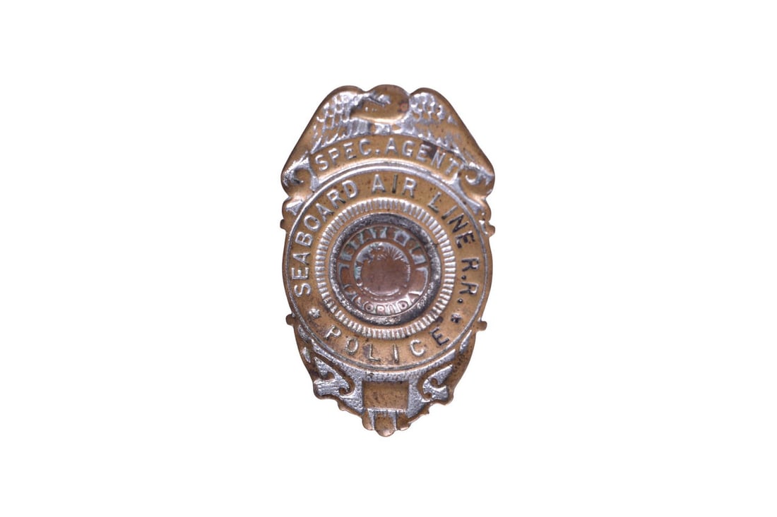 Pin back brass badge marked Spec. Agent Seaboard Air Line Police with State of Florida in the (1 of 2)
